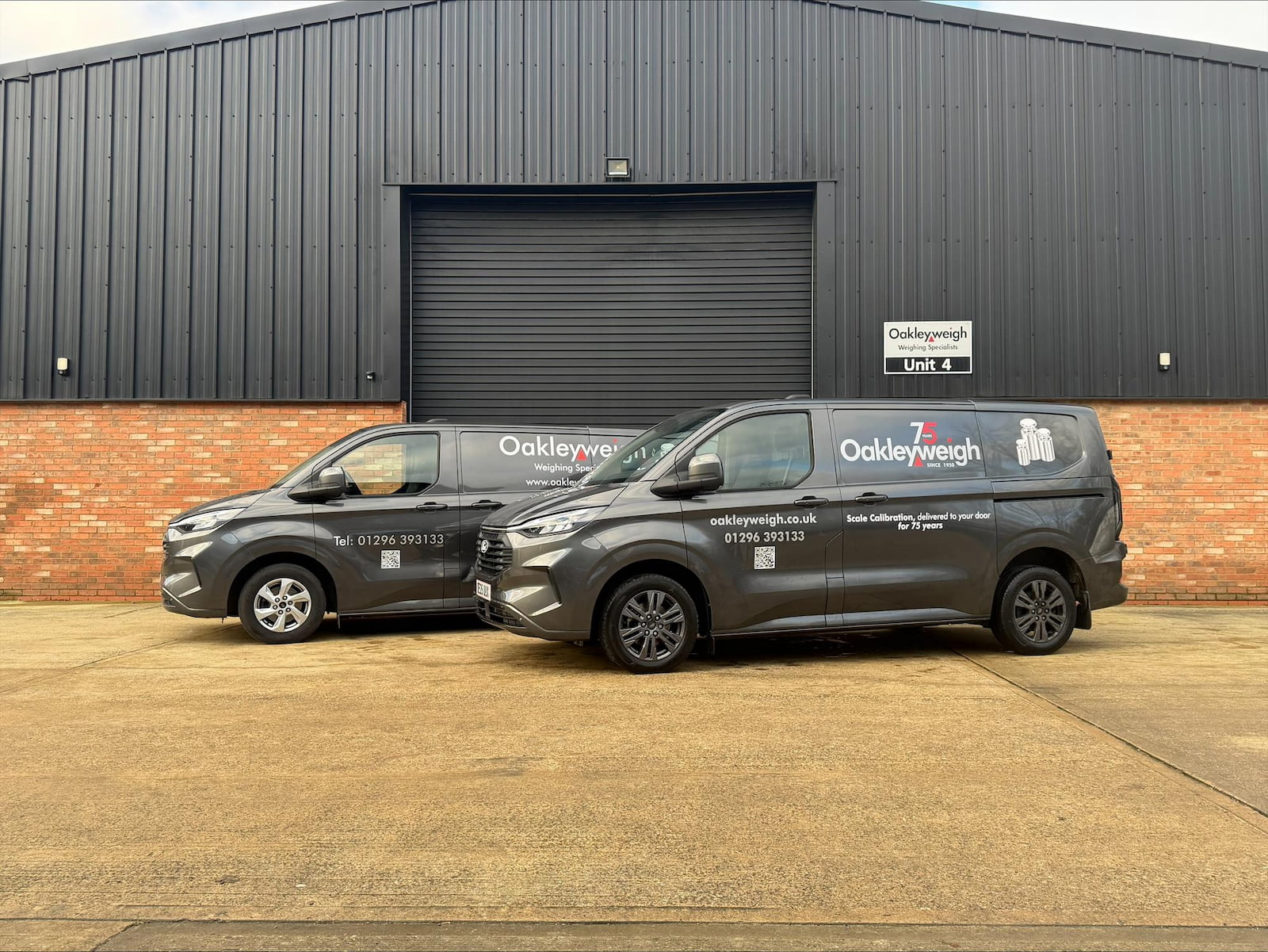 Two dark Oakleyweigh cars